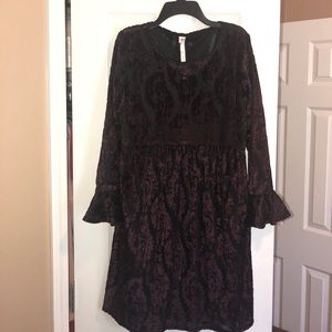 Black babydoll dress with deep plum velvet detail